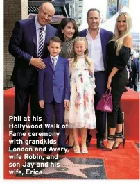  ?? ?? Phil at his Hollywood Walk of Fame ceremony with grandkids London and Avery, wife Robin, and son Jay and his wife, Erica