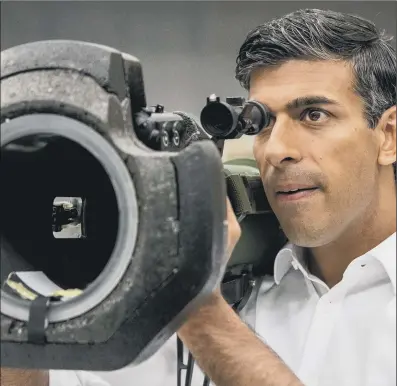  ?? PICTURE: PAUL FAITH/PA WIRE. ?? ON THE ATTACK: Rishi Sunak looks at a NLAW anti tank launcher, supplied to Ukraine, during a campaign visit to Thales Defence System plant in Belfast, as part of his campaign to be leader of the Conservati­ve party and the next Prime Minister.