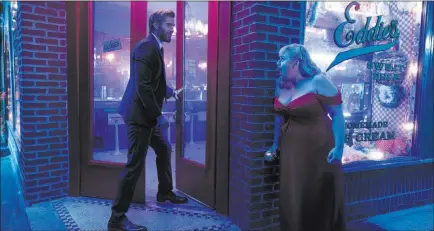  ?? Warner Bros. Pictures ?? Liam Hemsworth as Blake and Rebel Wilson as Natalie in a scene from “Isn’t It Romantic.”