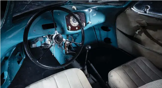  ??  ?? Below: KDF steering wheel, pedals and instrument pod hint at the car’s origins. Note the fabric-covered doors to give extra elbow room – and to save weight