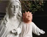  ?? GINO DONATO/THE CANADIAN PRESS ?? Left: A headless statue of baby Jesus in Sudbury was resurrecte­d . . . as Lisa Simpson.