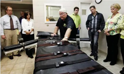  ?? ?? Warden Burl Cain discusses the gurney used for lethal injections, 2009, at the Louisiana state penitentia­ry. Photograph: Judi Bottoni/AP