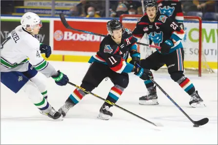  ?? STEVE DUNSMOOR/Special to ONG ?? Kelowna Rockets forward Pavel Novak eludes a defender from the Seattle Thunderbir­ds during a game on Dec. 11, 2021, at Prospera Place. The clubs are to begin the WHL playoffs against each other tonight in Washington state.