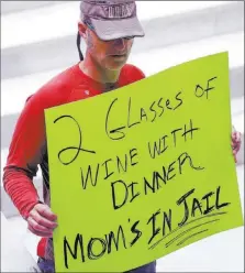  ?? RICK BOWMER/ THE ASSOCIATED PRES ?? A protester holds a sign March17 during a rally at the Utah State Capitol in Salt Lake City. Utah’s governor has announced he will sign legislatio­n giving the state the strictest DUI threshold in the country.