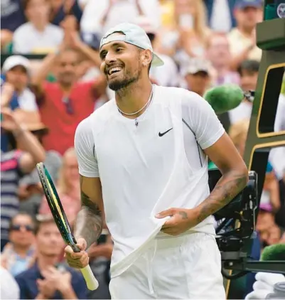  ?? ALBERTO PEZZALI/AP ?? Nick Kyrgios soaks in his 4-6, 6-4, 7-6 (2), 3-6, 6-2 win over Brandon Nakashima in the fourth round at Wimbledon on Monday.