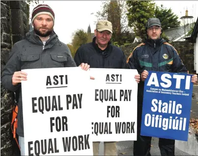  ?? Photo by Michelle Cooper Galvin ?? ASTI members Shane Healy, Pat Lucid and Jeremy Kenny on the picket line at St Brendan’s College, Killarney, on Tuesday.