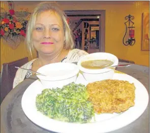  ?? MICHAEL DONAHUE/THE COMMERCIAL APPEAL ?? Melissa Wade with a country fried chicken dinner at Dale’s Restaurant in Southaven.