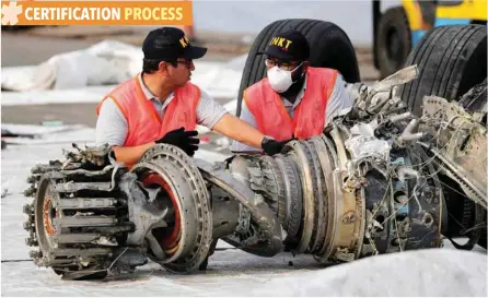  ?? — Reuters ?? Indonesian officials examine a turbine engine from the Lion Air flight JT610 at Tanjung Priok port in Jakarta, in this file photo.