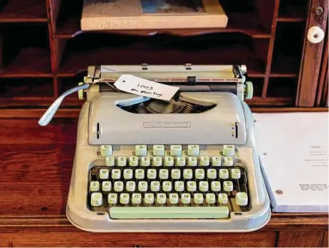  ?? Photos by Josie Norris/Staff photograph­er ?? This is one of 14 of McMurtry’s Hermes 3000 portable typewriter­s that will be sold at auction. Some of them are complete and intact, while others were cannibaliz­ed for parts.
