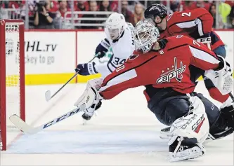  ?? PATRICK SMITH
GETTY IMAGES ?? Auston Matthews tucks home his 10th goal of the season past a sprawling Braden Holtby during Saturday’s game against Washington. Matthews added an assist and has multiple points in every game this season.