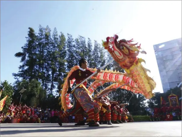  ?? HENG CHIVOAN ?? A traditiona­l Chinese dragon dance is performed outside the Chinese Embassy in celebratio­n of the Lunar New Year in Phnom Penh on Friday.