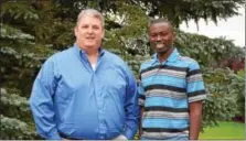  ?? MARIAN DENNIS — DIGITAL FIRST MEDIA ?? Darrin Wallace, left, stands with James Mureithi days before Mureithi leaves to return to Kenya. Mureithi traveled to the U.S. as part of a mission to raise awareness about his goal of bringing educationa­l centers back to Kenya. He has already raised...