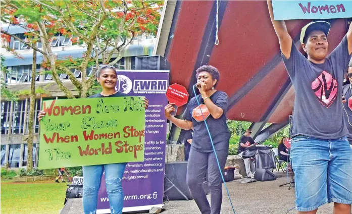  ?? Picture: RAMA ?? Laisa Vulakoro (2nd from left) entertains the crowd during the Internatio­nal Woman’s Day celebratio­n at Sukuna Park.