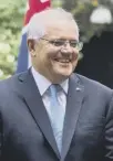  ??  ?? 0 Australian PM Scott Morrison signed the deal