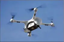  ?? UPS ?? The deliveries last week went via a Matternet M2 drone system. The drone hovered about 20 feet over properties and “slowly lowered the packages by a cable and winch to the ground,” according to UPS.