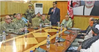  ?? AP PHOTO ?? The head of NATO troops in Afghanista­n, Gen. Scott Miller, center left, Kandahar Gov. Zalmay Wesa, center right, and their delegation­s attend a security conference, in Kandahar, Afghanista­n on Thursday. The three top officials in Afghanista­n’s Kandahar province were killed, including Wesa, when their own guards opened fire on them at the conference Thursday, the deputy provincial governor said.