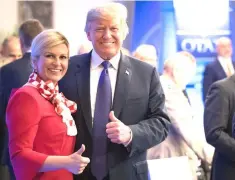  ??  ?? Croatia President Kolinda Grabar-Kitarovic and US President Donald Trump give a thumbs up at the start of a dinner at the Art and History Museum at the Parc du Cinquanten­aire during the NATO Summit in Brussels, Belgium July 11. — Reuters photo