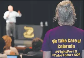  ?? Photos by John Leyba, The Denver Post ?? Casey DiGaetano of Aurora listens to U.S. Rep. Mike Coffman during his town hall Tuesday at Prairie View High School in Henderson.