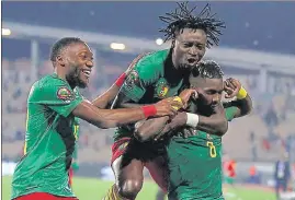  ?? AFP ?? Cameroon defender Ambroise Oyongo (R) and forward Karl Toko Ekambi celebrate their victory after the penalty shoot-out at the end of the Africa Cup of Nations third place match against Burkina Faso at Stade Ahmadou-Ahidjo in Yaounde on Saturday.