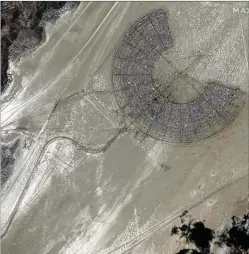  ?? C. 2023 MAXAR TECHNOLOGI­ES VIA AP ?? A satellite image shows traffic leaving the Burning Man festival Monday in the Black Rock Desert north of Reno, Nevada. Partygoers stranded for days at the festival by a storm began leaving Monday afternoon after muddy roads dried up enough for them to begin their exodus.