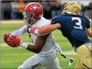  ?? BOB RAINES — DIGITAL FIRST MEDIA ?? La Salle’s Tom Flavin grabs St. Joseph’s Prep’s D’Andre Swift during a game in October. Prep won the 6A title last weekend in Hershey.