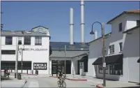  ?? AP FILE PHOTO — RICH PEDRONCELL­I ?? A bicyclist passes the Monterey Bay Aquarium in April 2020.