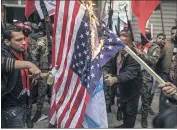  ?? (Photo MaxPPP) ?? Des drapeaux israéliens et américains ont été brûlés