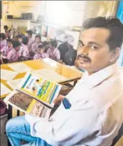  ?? HT PHOTOS: PRAMOD THAKUR ?? Rajan Garud, a teacher at Khorichapa­da zilla parishad school in Palghar, translated textbooks into Warli, a language spoken in Palghar, south Gujarat and parts of Nashik, to help students transition to Marathi with ease.