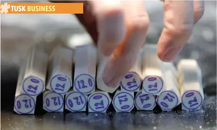  ?? — Reuters ?? Evenly-sized cut pieces of ivories for making ‘hanko’ or carved name seals are seen at a factory in Tokyo, Japan.