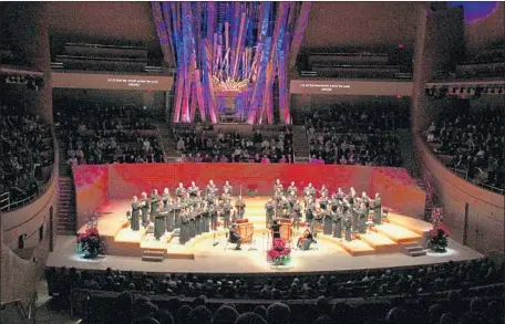  ?? Photograph­s by Patrick Brown ?? THE LOS ANGELES Master Chorale performs Bach motets while conducted by Jenny Wong on Sunday at Walt Disney Concert Hall.