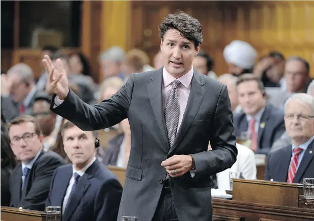  ?? ADRIAN WYLD / THE CANADIAN PRESS ?? Prime Minister Justin Trudeau rises during question period in the House of Commons on Tuesday. The Trudeau Liberals have been diminished by tax-reform proposals on private corporatio­ns outlined during the summer, John Ivison writes.