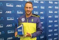  ?? – AFP ?? CAPTION KICKER: South Africa’s captain Faf du Plessis holds the trophy after the day five of their third Test match against New Zealand was called off due to rain in Hamilton on Wednesday.