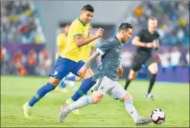  ?? AP ?? Argentina's Lionel Messi dribbles past Brazil's Thiago Silva during a friendly on Friday.