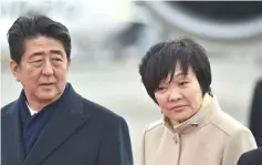  ??  ?? File photo shows Abe (left) and his wife Akie Abe (right) at Tokyo’s Haneda Airport. — AFP photo