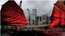  ??  ?? The central business area of the Hong Kong skyline as seen through the sails of a traditiona­l junk style boat