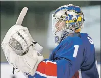  ?? AP PHOTO ?? South Korea’s goalkeeper Matt Dalton watches teammates play in their ice hockey men’s top division match against Kazakhstan at the Asian Winter Games in Sapporo, northern Japan on Feb. 22.