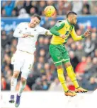  ??  ?? Swansea’s Sigurdsson challenges Redmond.