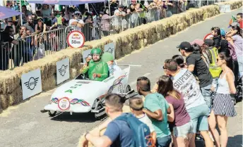  ??  ?? Winning team SA Bobsled make their way down the course at the Red Bull Box Cart Race in Sandton. | Bull Content Pool