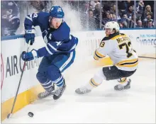  ?? NHLI VIA GETTY IMAGES FILE PHOTO ?? Morgan Rielly, left, of the Maple Leafs skates against Charlie McAvoy of the Boston Bruins in Game 3 of the NHL’s Eastern Conference first-round playoff series at Air Canada Centre in Toronto last April 16.