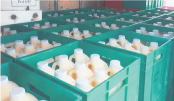  ?? Photos / Supplied ?? Crates of raw milk being sent across Hawke’s Bay.
