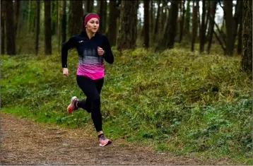  ??  ?? Phil Healy upping the pace as she tackles one of the many trails through the Raven Point wood.