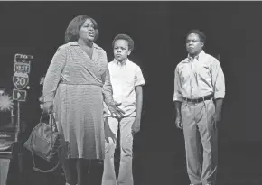  ?? KEN HOWARD/MET OPERA ?? Latonia Moore, from left, as Billie, Walter Russell III as Char’es-baby and Will Liverman as Charles during a rehearsal for Terence Blanchard’s “Fire Shut Up in My Bones,” opening the Metropolit­an Opera seasib.