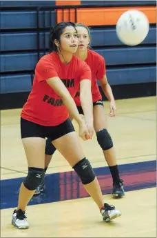  ?? Photograph by Samantha Baker ?? Blackhawk Diana Salazer passes the volleyball as teammate Emma Pitts, right, watches Wednesday, Aug. 1, at Rogers Heritage High School during a set against Booneville High School. More than 20 schools from northwest Arkansas attended a volleyball team...