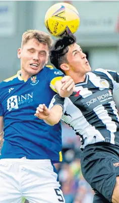  ??  ?? Jason Kerr, left, challengin­g St Mirren’s Jamie McGrath.