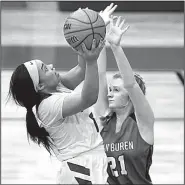  ?? Arkansas Democrat-Gazette/THOMAS METTHE ?? (left) puts up a shot over Van Buren’s Rylee Ryan (21) during the Lady Wampus Cats’ 60-38 victory over the Lady Pointers on Friday at the Class 7A girls state tournament in North Little Rock.