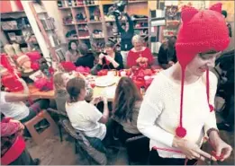  ?? Mel Melcon Los Angeles Times ?? BETH WOOD of Glendale wears a protest hat that she knitted as she begins working on another one during a class at the Little Knittery in Atwater Village.