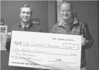  ?? Submitted photo ?? ■ UA Cossatot Developmen­t Coordinato­r Dustin Roberts, left, receives a $5,000 check from Horatio State Bank CEO Ned Hendrix, right. This is the third donation the bank has made to the Legacy 2020 Campaign, which focuses on community members and businesses that wish to invest in the developmen­t of the college on all four campuses: De Queen, Nashville, Ashdown and Lockesburg.