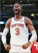  ?? Noah K. Murray / Associated Press ?? Knicks center Nerlens Noel reacts after the Knicks scored against the Rockets in New York on Saturday.