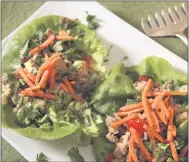  ?? PHOTOS BY CATHY THOMAS ?? Lettuce wraps stuffed with ground turkey, rice, bell pepper and jicama can be toppedwith carrots or cilantro.