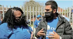  ?? Picture: FREDLIN ADRIAAN ?? ‘WE GET THINGS DONE’: DA national spokespers­on Siviwe Gwarube and the party’s northern areas constituen­cy leader Yusuf Cassim at the Wonderwoni­ngs Community Centre in West End